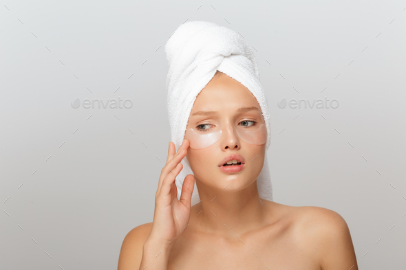 Portrait of young upset lady with white towel on head without ma
