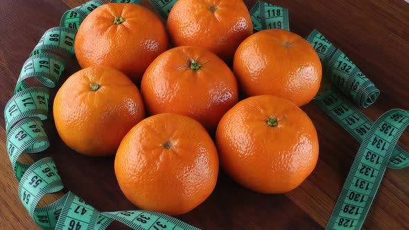 Mandarin And Tape Measure Rotating 1 alt