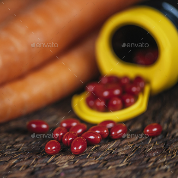 Beta Carotene Supplement Pills and Vegetables - Stock Photo - Images