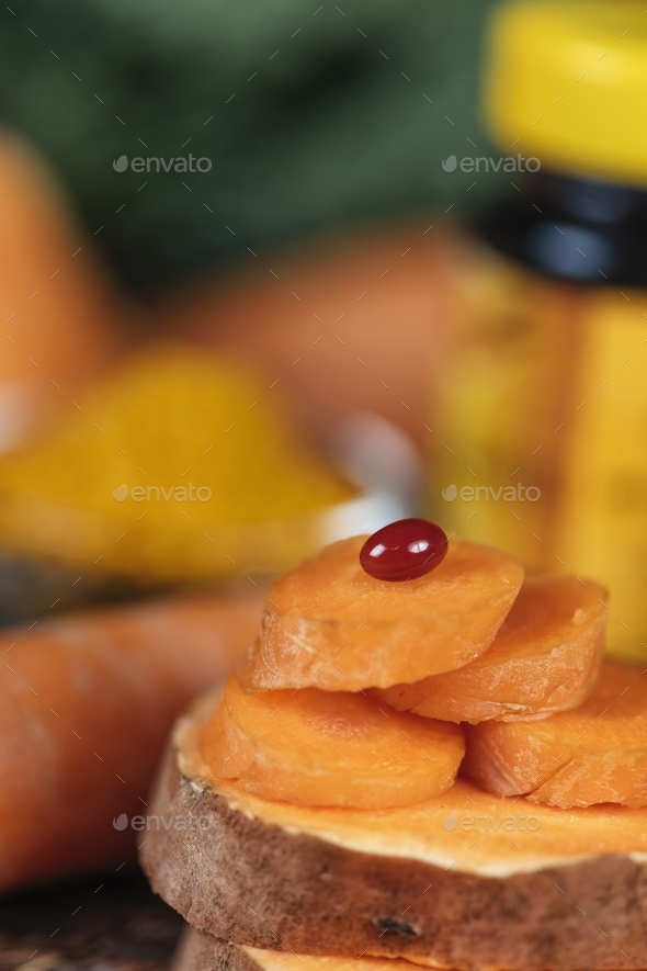 Beta Carotene Supplement Pills and Vegetables - Stock Photo - Images