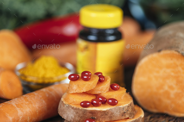 Beta Carotene Supplement Pills and Vegetables - Stock Photo - Images