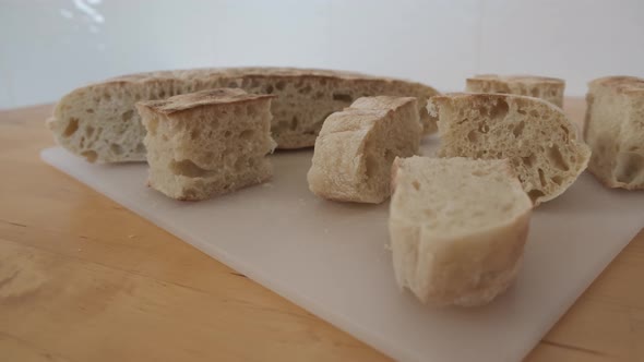 Close-up on pieces of traditional bread from Madeira called bolo do caco. Handheld shot alt