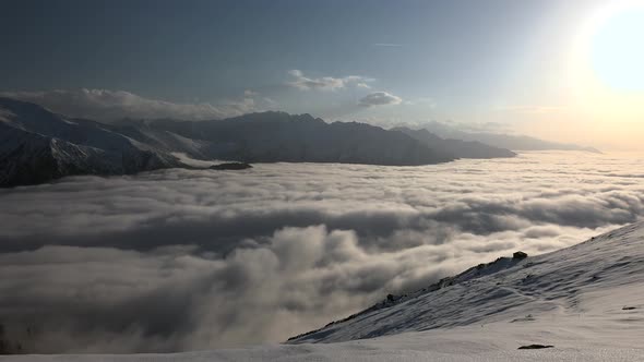 Sunsets Over The Clouds On Snowy Mountains alt