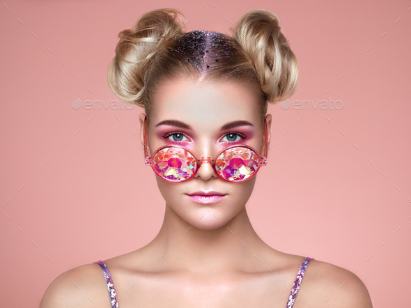 Portrait of beautiful young woman with colored glasses - Stock Photo - Images