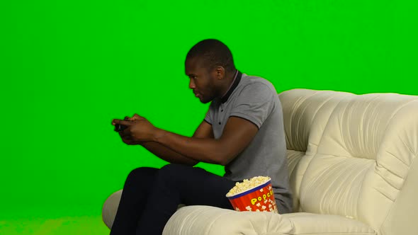 Man Gets the Win in the Game on the Console and Dancing. Green Screen alt