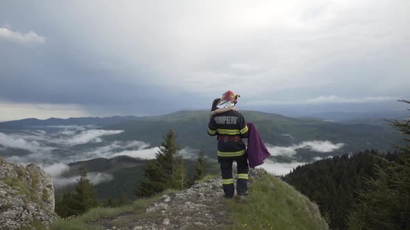 Firefighter Carrying an Woman to Safety
