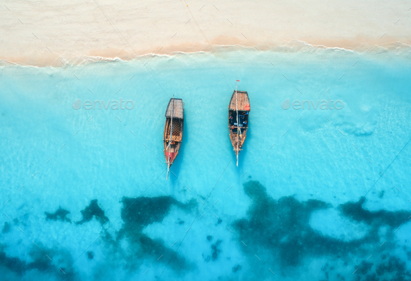 Aerial View Of The Fishing Boats In Clear Blue Water At Sunset Stock Photo By Den Belitsky