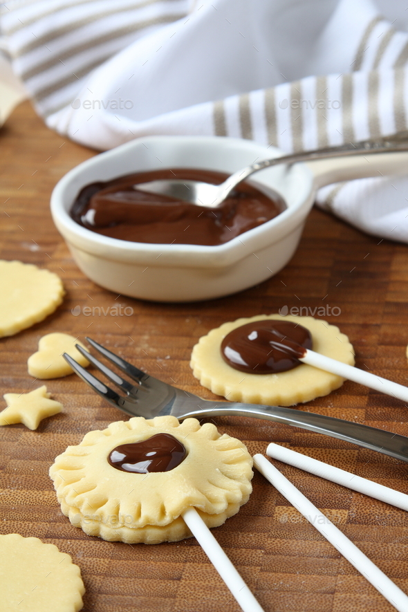 Process of baking shortbread cookies pops with chocolate