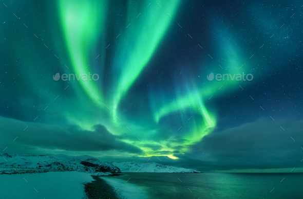 Aurora borealis over ocean. Northern lights - Stock Photo - Images