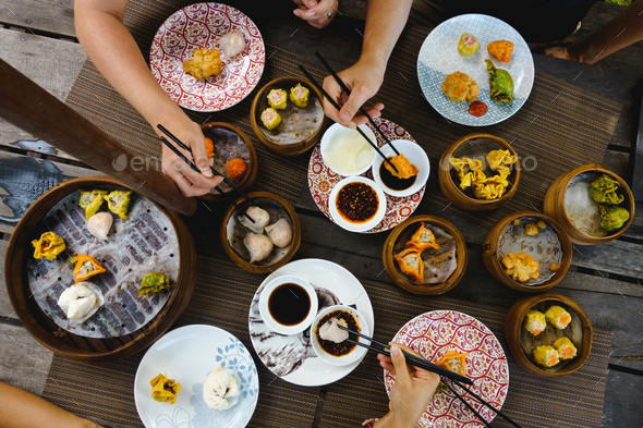 Vibrant shot of feasting on chinese steamed and fried buns