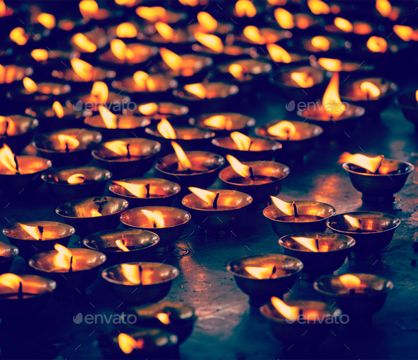 Burning candles in Buddhist temple, McLeod Ganj - Stock Photo - Images