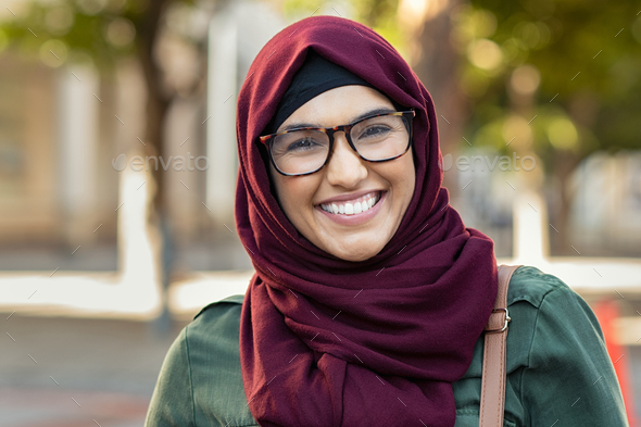 Smiling young woman in hijab - Stock Photo - Images