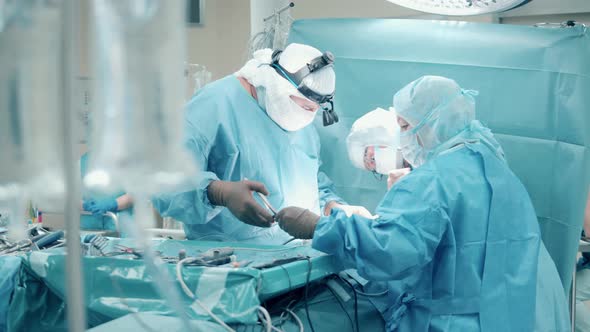 Surgeons are Carrying Out an Operation with Medical Tools alt