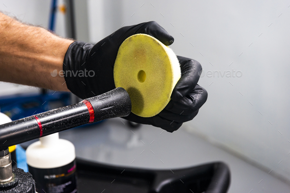Car polish wax worker hands cleaning polishing sponge before polishing - Stock Photo - Images