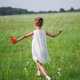 little girl with poppy in summer field - PhotoDune Item for Sale