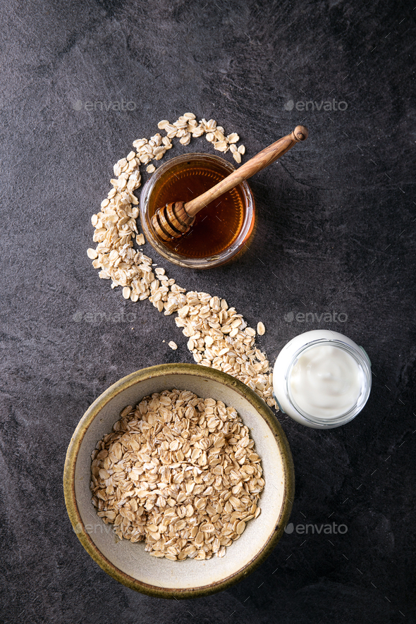 Dry oats served with fresh greek yogurt Stock Photo by Feirlight PhotoDune