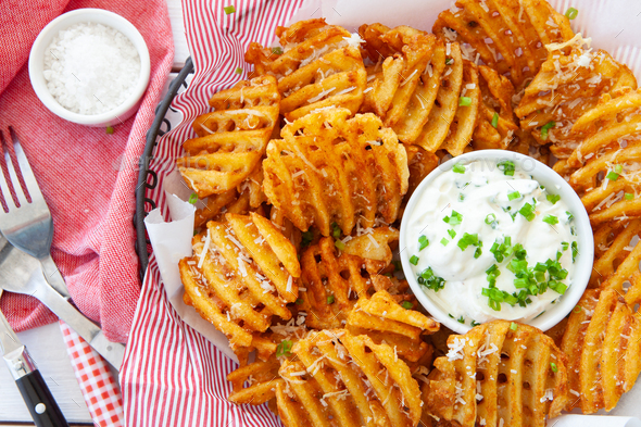 Crispy waffle fries with sour cream