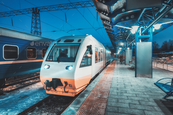 White high speed train on the railway station at night - Stock Photo - Images