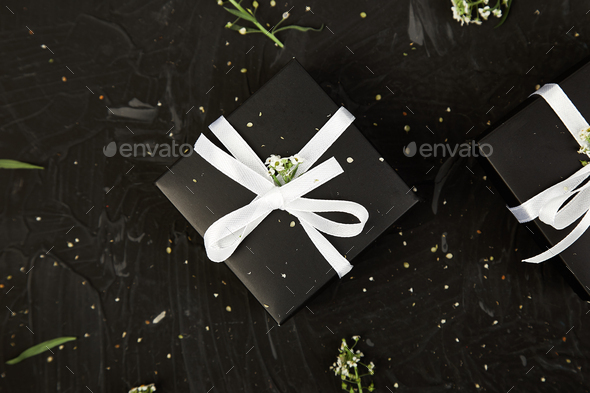 Wrapping modern Christmas or Birthday gifts presents - Stock Photo - Images
