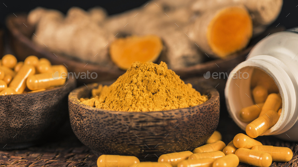 Curcumin Herbal Supplement Capsules and Turmeric Powder - Stock Photo - Images