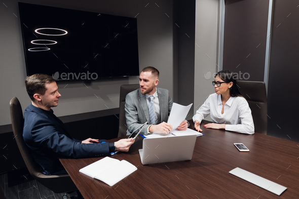 Startup business, creative business people of different age and races gather in meeting room in dark - Stock Photo - Images
