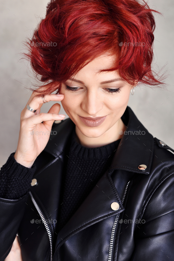 Portrait of a beautiful young red-haired woman with short hair Stock Photo  by Nataljusja