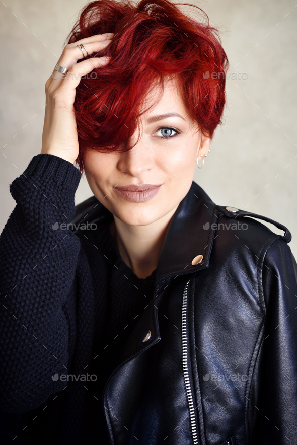 Portrait of a beautiful young red-haired woman with short hair l - Stock Photo - Images