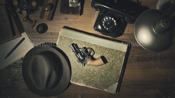 Noir 1950s style detective desktop with revolver