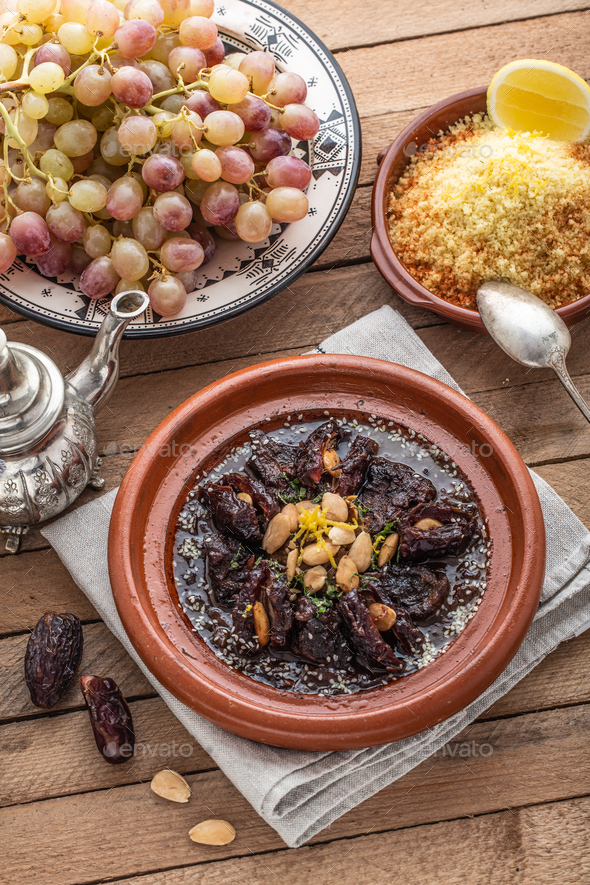 Moroccan tajine of beef with dates and almongs Stock Photo by kopachinsky