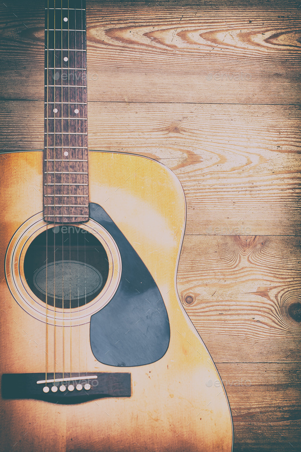 Acoustic guitar on rough wooden background Stock Photo by michelangeloop