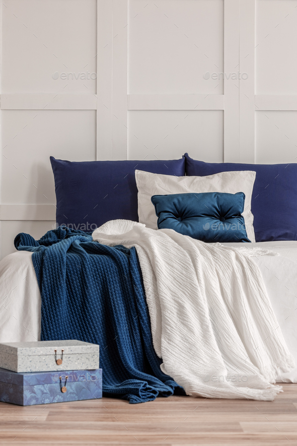 Simple Navy Blue And White Bedroom Interior With Cozy Bed With