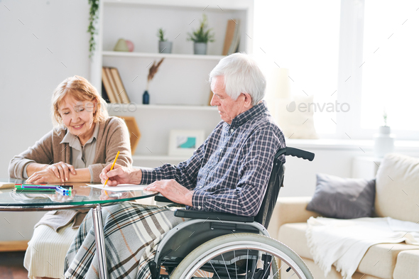 Handicapped man drawing - Stock Photo - Images