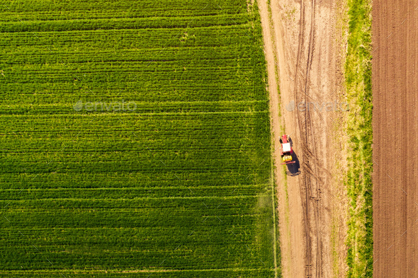 Aerial view of tractor with attached crop sprayer
