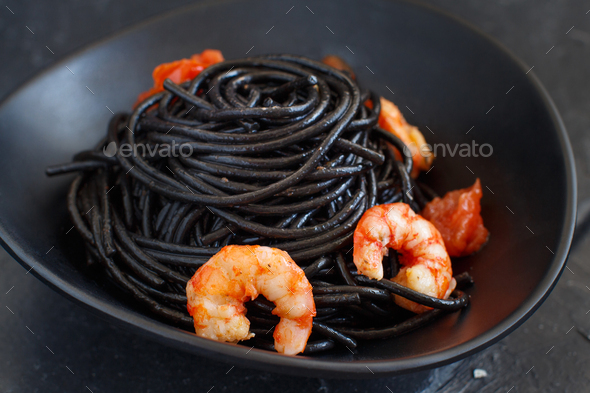 Squid Ink Pasta With Prawns And Tomatoes Stock Photo By Katrinshine