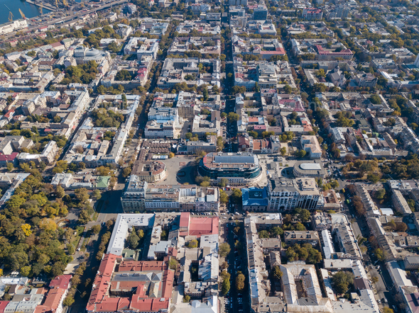 Aerial view from the drone on the shopping center, buildings and streets with cars on a sunny day - Stock Photo - Images
