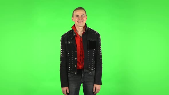 Guy Smiles Broadly and Winks . Green Screen alt
