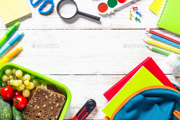Back to school concept. Lunch box with stationery and backpack - Stock Photo - Images