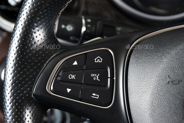 Hands free and media control buttons on the steering wheel