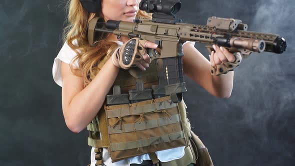 Woman Sniper with Sniper Rifle. Female in Army Soldier with Machine Gun. Slow Motion alt