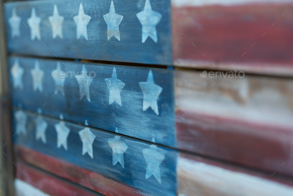 Texture of american flag painted over woodboard