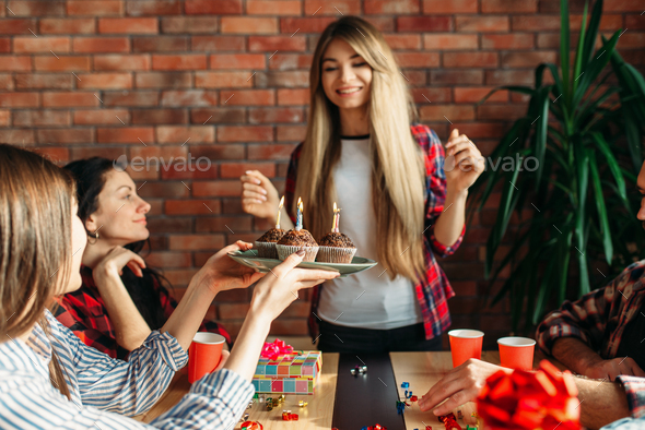 Female university student gets a sweet gift - Stock Photo - Images
