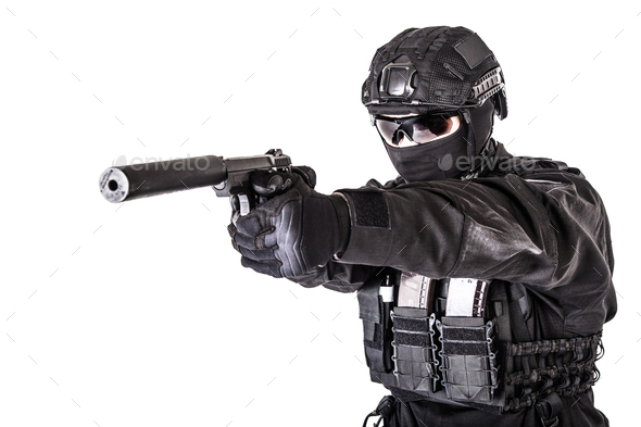 Studio portrait of SWAT officer aiming with pistol - Stock Photo - Images