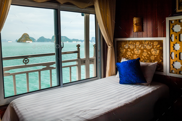 Bed in cruise ship cabin. Halong Bay, Vietnam