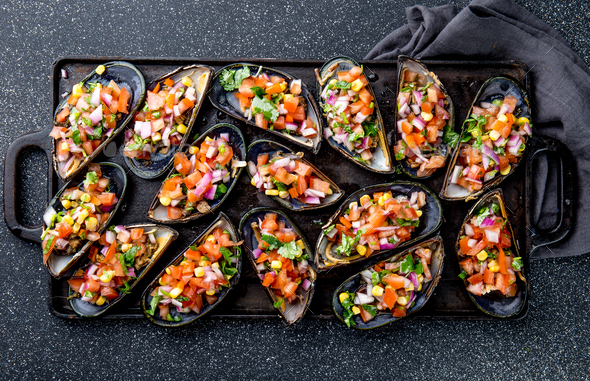 Peruvian Choros a La Chalaca. Mussels with Tomato, Onion and Cilantro Sauce. Top view - Stock Photo - Images