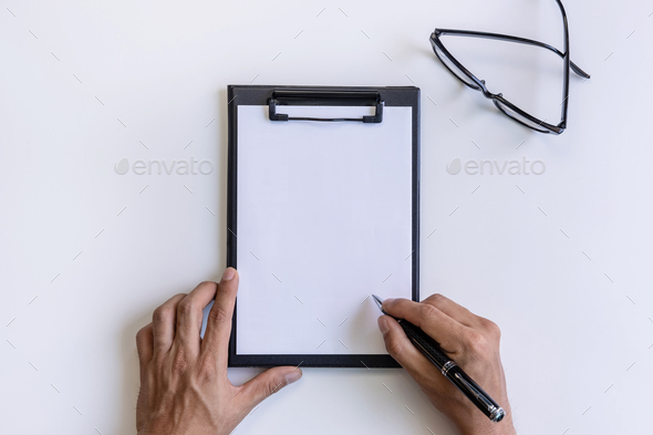 Empty file folder with hand writing on business desk office with copy space, Top view
