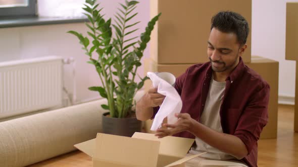 Indian Man Packing Boxes and Moving To New Home 32 alt