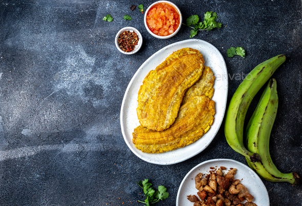 Colombian Caribbean Food. Patacon or toston, fried and flattened whole green plantain banana