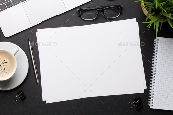 Office workplace table with blank paper page - Stock Photo - Images