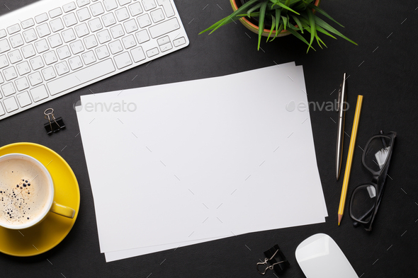 Office workplace table with blank paper page - Stock Photo - Images