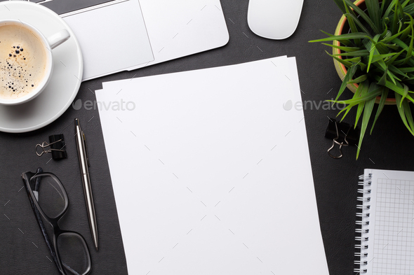 Office workplace table with blank paper page - Stock Photo - Images